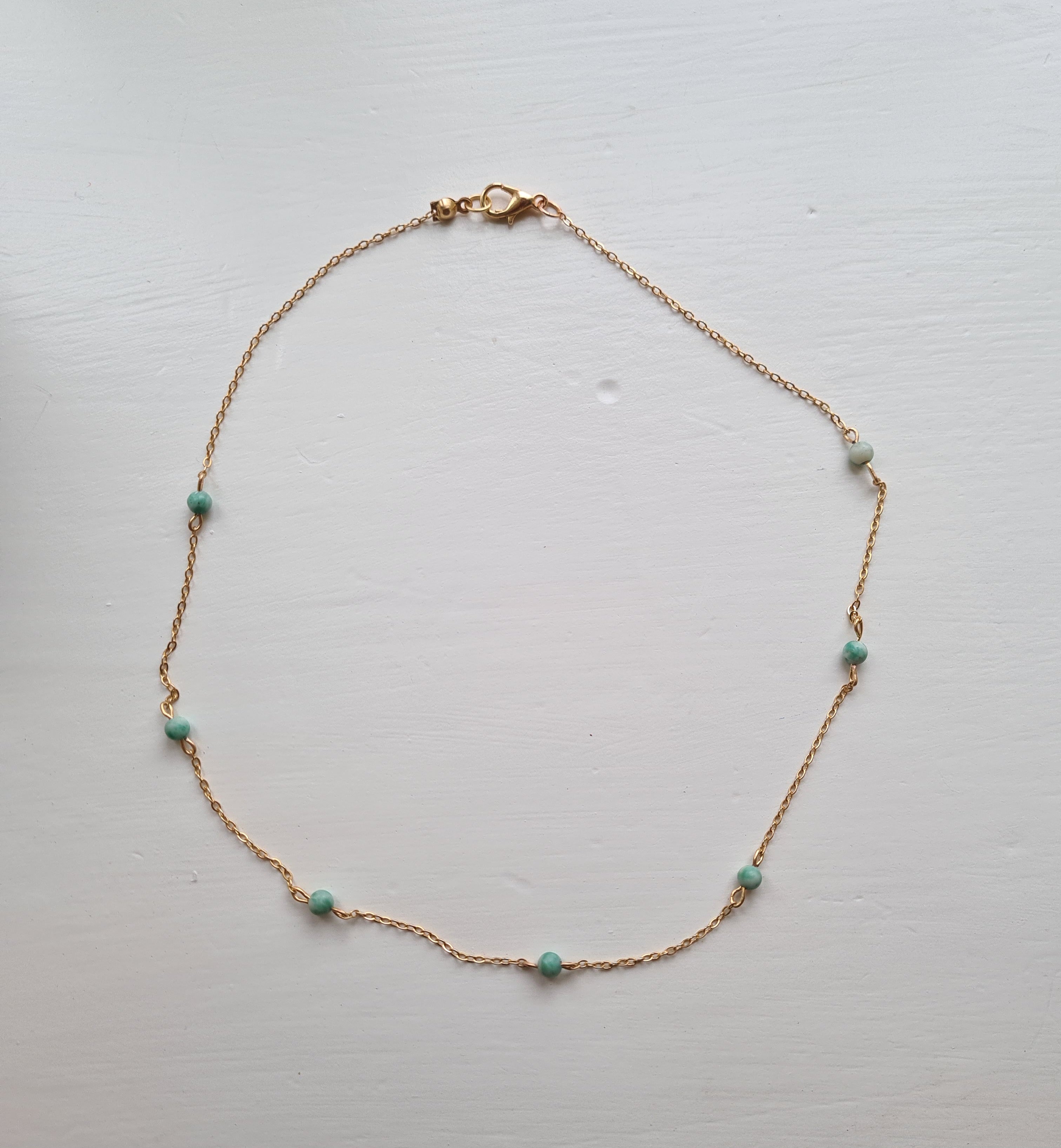 Amazonite choker necklace flat lay on white surface