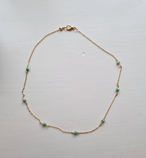 Amazonite choker necklace flat lay on white surface