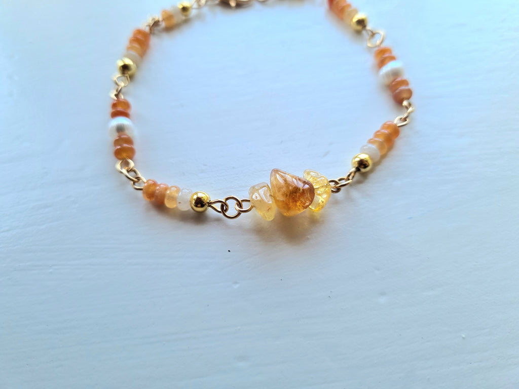 Handmade citrine bracelet held in hand