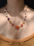 Mixed gemstone necklace worn on model
