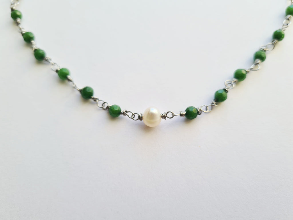 Full necklace flat lay on white background