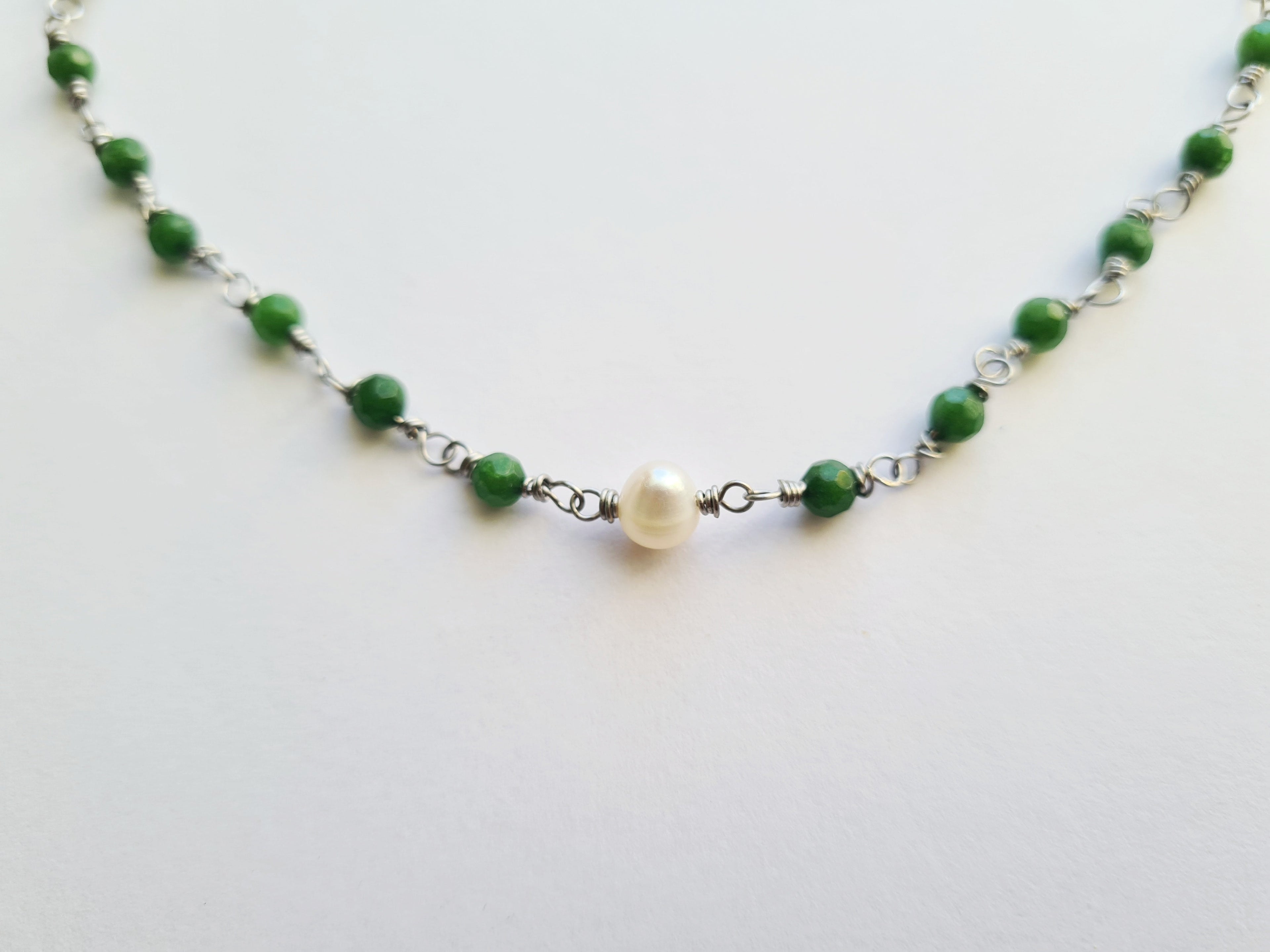 Full necklace flat lay on white background