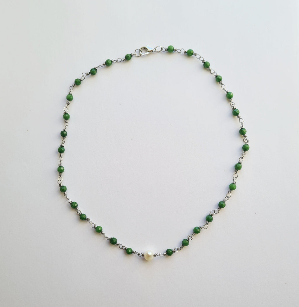 Close-up of wire-wrapped green jade beads with freshwater pearl