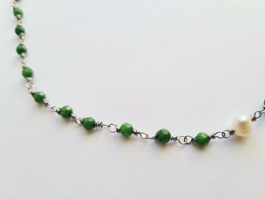 Green jade necklace worn on model